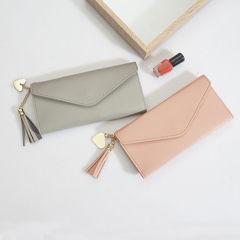 New tassel purse female long Korean student small fresh three fold Soft Leather Multi card women's wallet