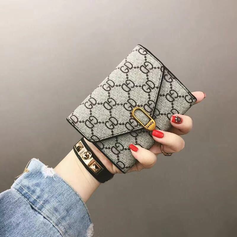 Ins popular European and American wallet female short student lady pocket card bag hand bag 30 fold Wallet fashion trend