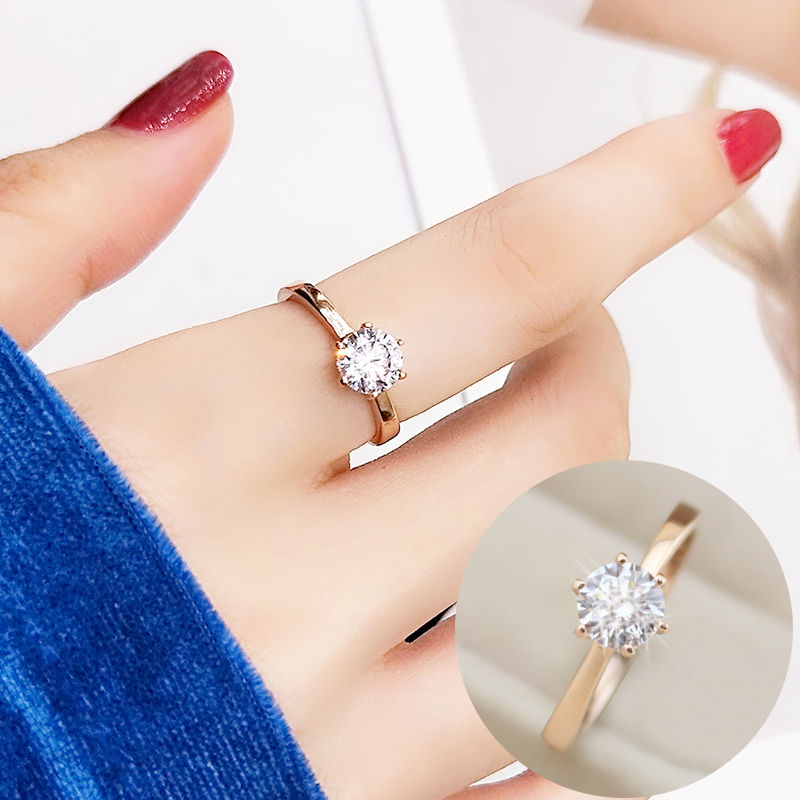 diamond ring in index finger