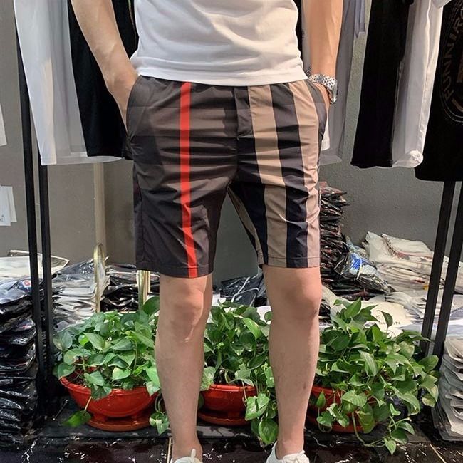 Kwai Tong, red man, the same social spirit boy five points, lattice shorts, Korean version, body speed, dry stretch beach pants.