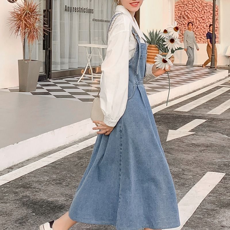 Spring and autumn new fat mm large size fashionable loose denim strap skirt women's meat cover show thin age reducing medium length dress