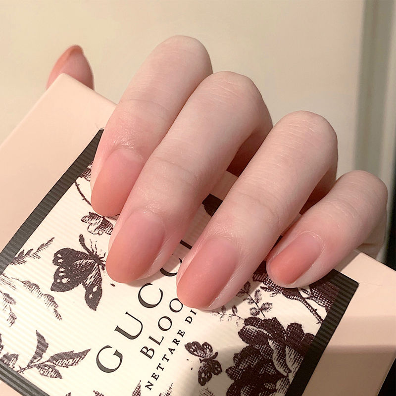 2020 peach pink nail polish, pink cherry blossom powder nail polish, small red book, manicure shop.