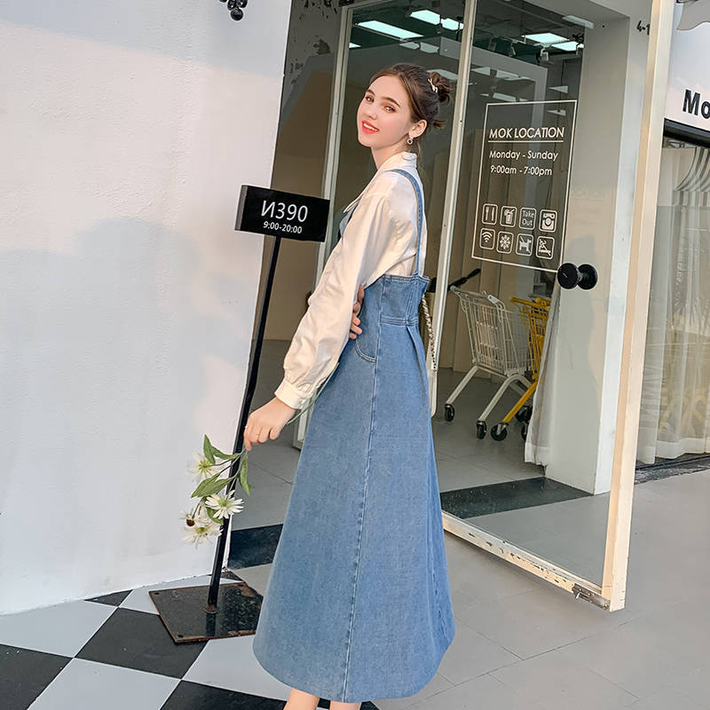 Spring and autumn new fat mm large size fashionable loose denim strap skirt women's meat cover show thin age reducing medium length dress