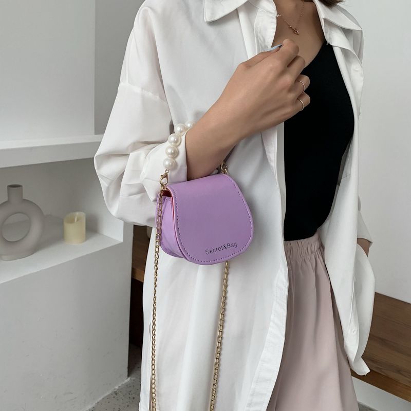 Mini bag women's 2021 new spring summer Korean versatile pearl messenger bag foreign style one shoulder chain saddle bag