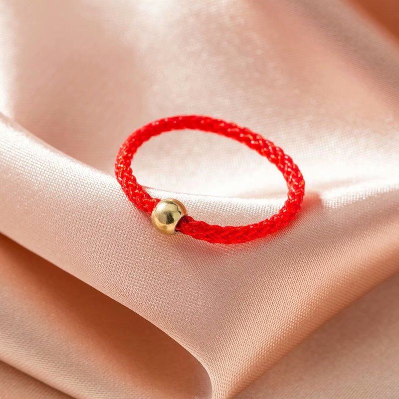 Douyin same style small golden bead ring female natal year transfer bead gold bean red rope weaving boudoir honey couple index finger ring