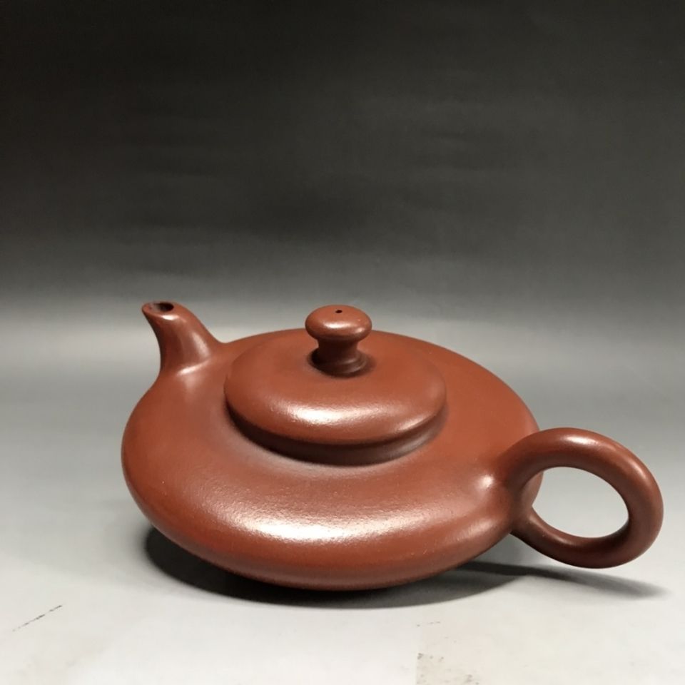 紫砂壶 品名:虚扁 底款:刘希 材质:紫砂 容量200cc  出水孔:网孔