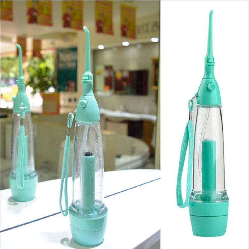 Hand operated air pressure portable tooth washer oral irrigator tooth cleaner