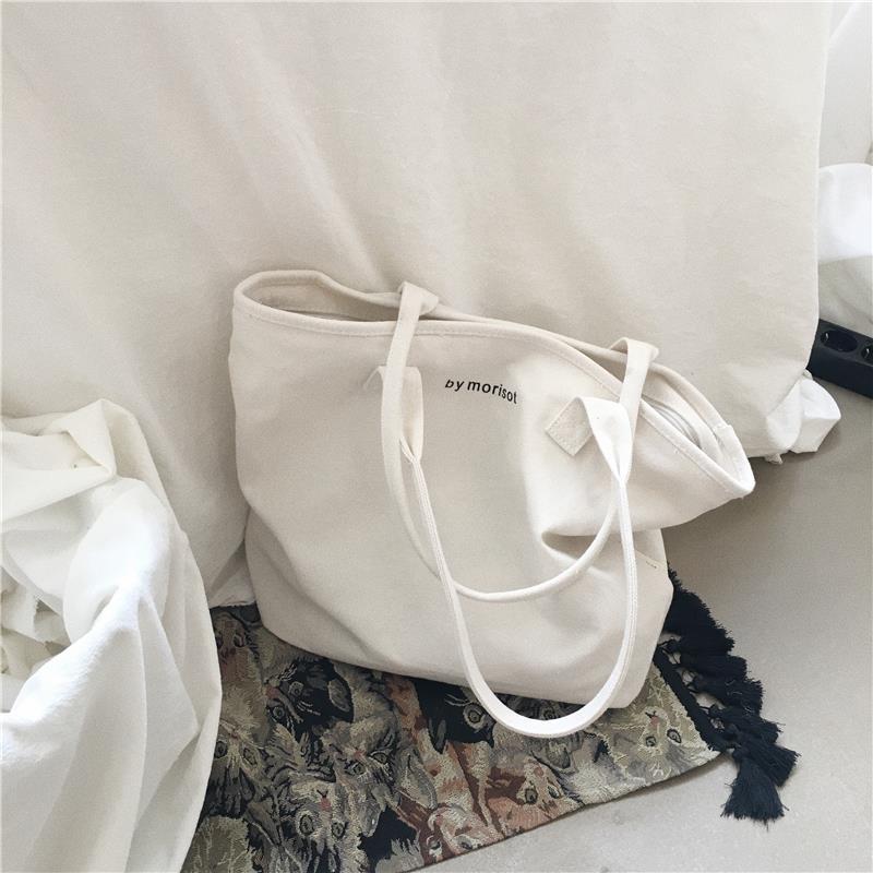 Korea's new large capacity minimalist letter single shoulder canvas bag simple portable women's bag solid color Tote Bag