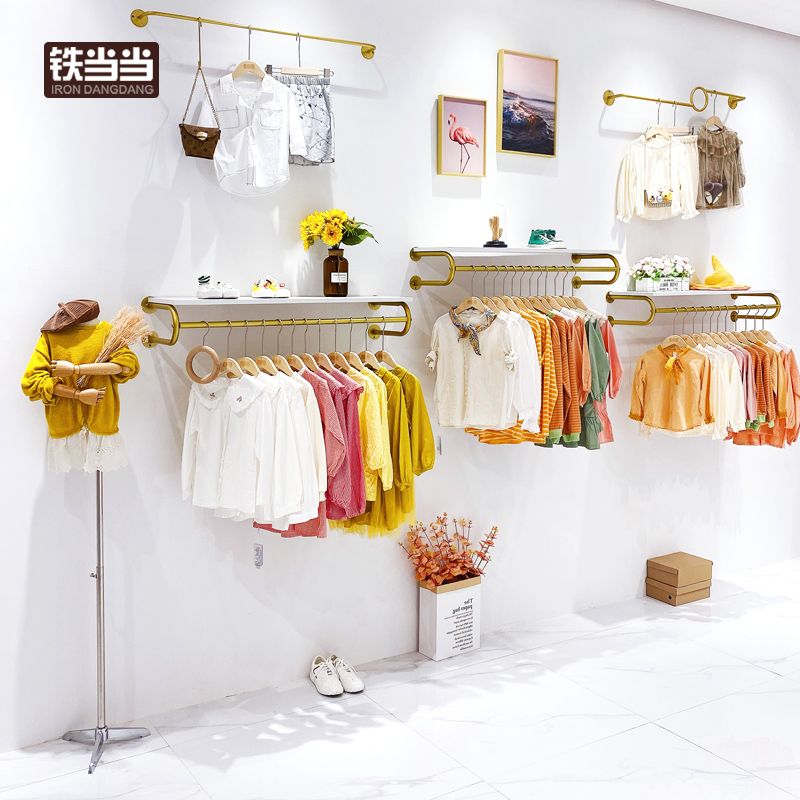 童装店展示架上墙壁挂式货架儿童侧挂服装店装修效果图设计挂衣架